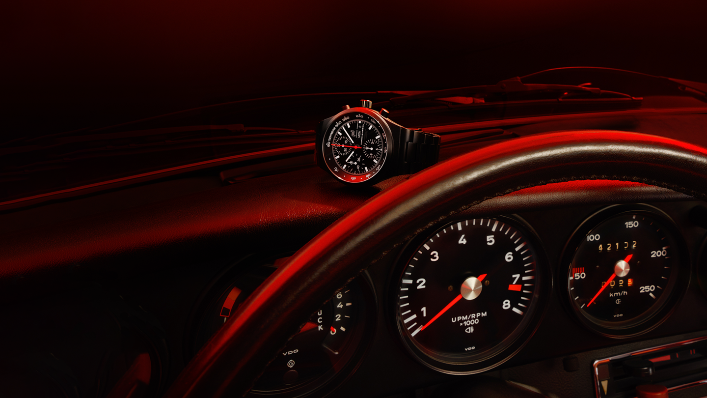 Shows Picture of chronograph1-all-black-numbred-edition-on-911-dashboard.png